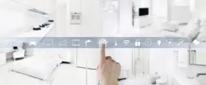 White room with a strip of smart home symbols including: music, cart, car, television, security camera, faucet, home, thermometer, wifi, lock, clock, lightbulb, clouds, etc