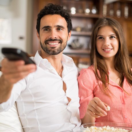 Couple Watching DISH TV at Home for Business