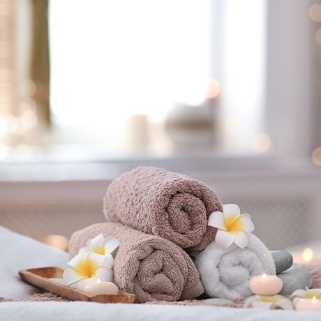 Beautiful spa composition on massage table in wellness center